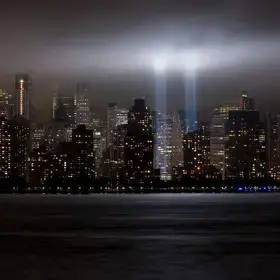 iew of Manhattan at night with lights representing the Twin Towers on September 11, 2009. Photo credit: Dov Harrington