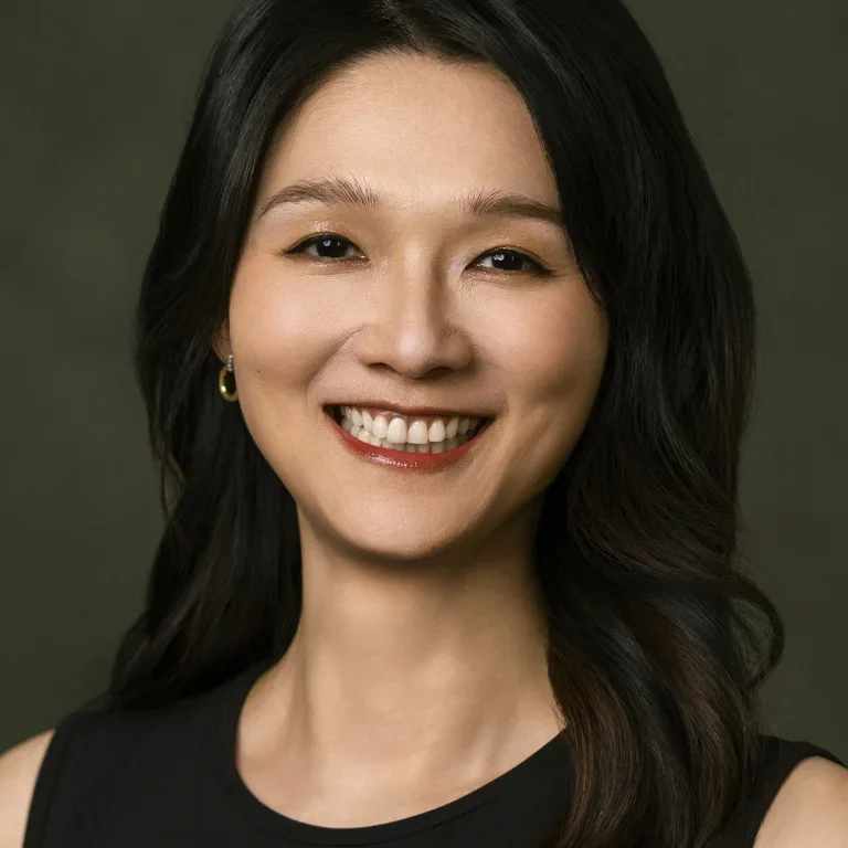 Hanqing Wang smiling against a neutral background