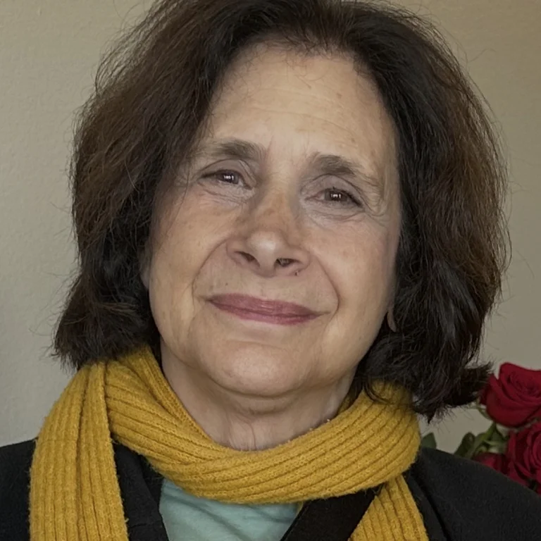 photo of Susan Cafetz Li wearing yellow scarf and green shirt