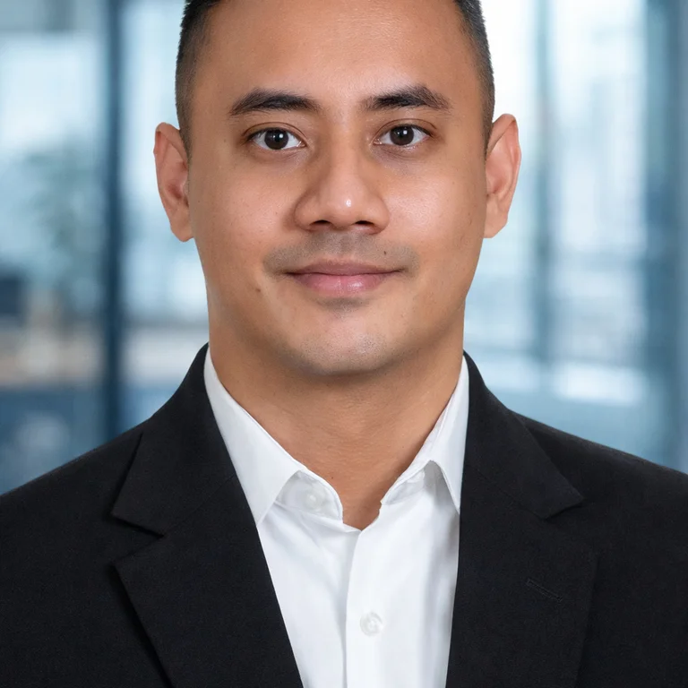 Tutor professional headshot of Ryvey Rahman with black suit and white shirt