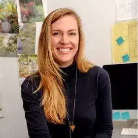 An updated headshot of Katherine "Kat" Aul Cervoni, funder of Staghorn landscape design firm.