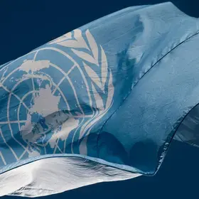 An image displays the United Nations flag. 