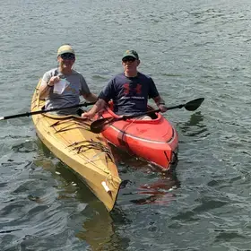 two men on two kayaks