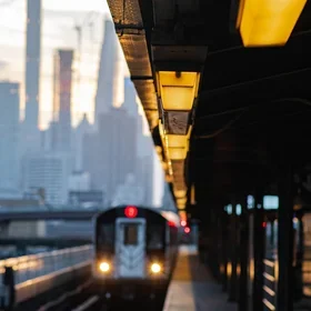 Blurred image of number three subway train arriving at platform