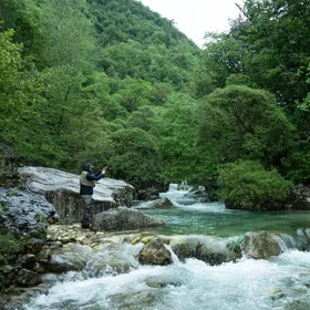 Fishing by a river (Inside Climate News)