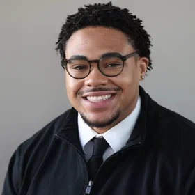 Professional headshot of IKNS student Isaiah Baker