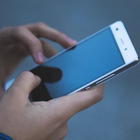 Hands holding smartphone