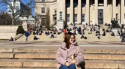Huixan Zhu poses in front of Low Library