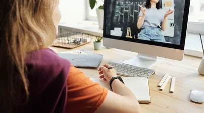 Stock Photo of Student Watching Instructor