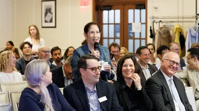 Faculty member speaking in an audience