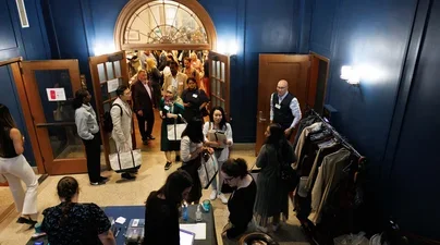 Faculty in entrance way at event
