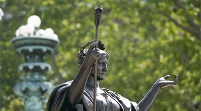 Image of Alma Mater statue at Columbia University with trees in the background